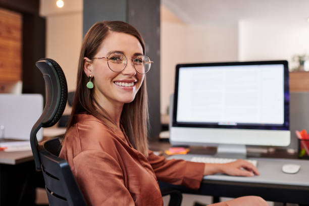istock Shot of a young businesswoman using a computer in a modern office 1317890795