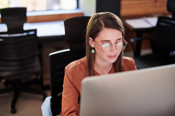 istock Shot of a young businesswoman using a computer in a modern office 1317890822