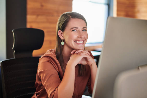 istock Shot of a young businesswoman using a computer in a modern office 1317890829