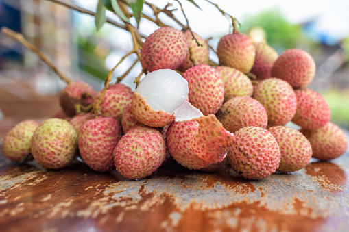 Fresh Lychee fruit on a wooden table