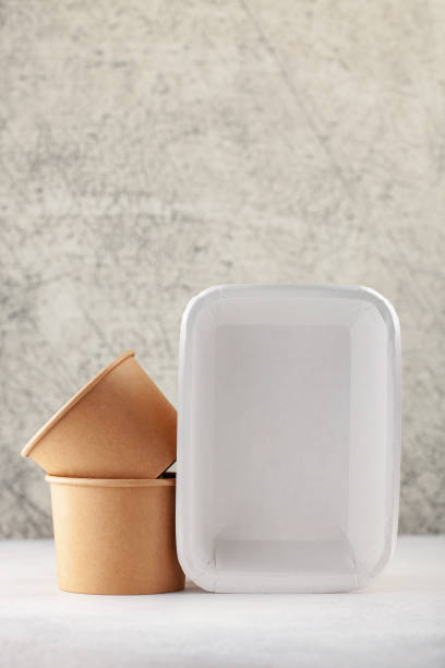 istock Set of  paper tableware on a gray background.  Mock up concept 1317893235