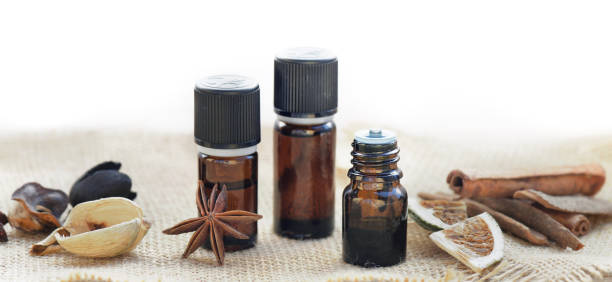 istock bottles of essential oil and cinnamon and anise  on a table 1317896608