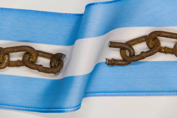 Broken chains on the Argentine flag. Concept of revolution and national independence