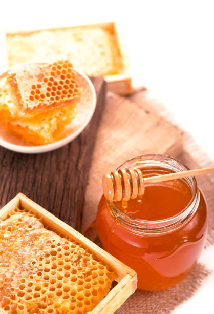 istock glass pot with floral honey isolated on white background 1317899314
