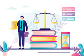 istock Male lawyer holds license. Advocate signed business agreement. Lawbooks and scales on background 1317899320