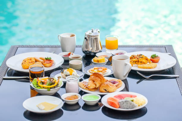 istock American Breakfast Set on Table Next to Poolside in Resort 1317899982