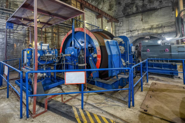 istock Huge shaft elevator machine. Modern equipment for lifting and lowering the cage shaft 1317901067