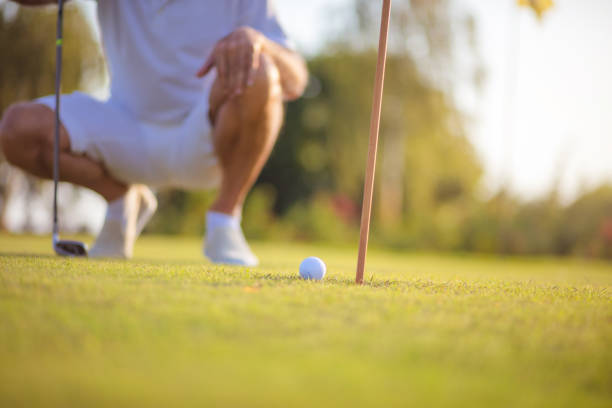 istock Senior man playing golf. Focus is on ball. Golf time. 1317903369