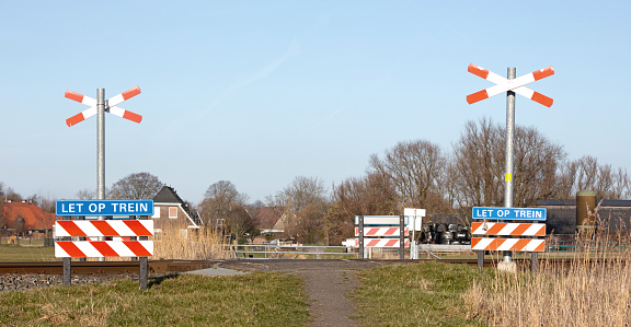 Unguarded railroad crossing in the Netherlands, selective focus