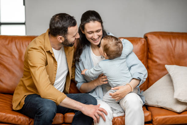 istock Happy father, mother and little son are playing 1317903614