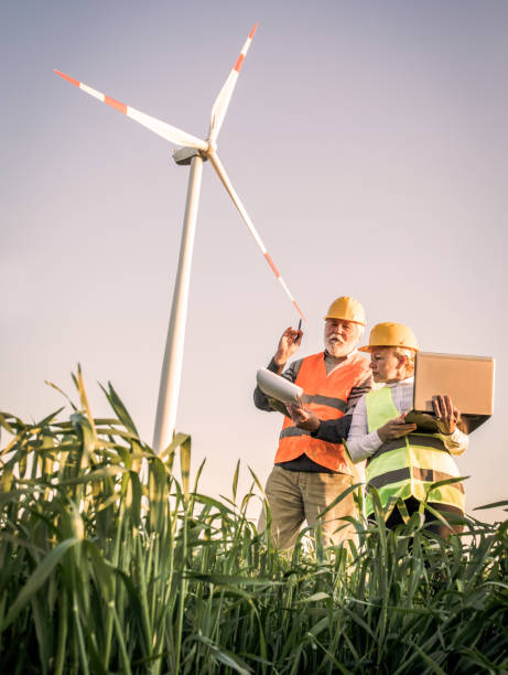 istock Windmill engineers inspection and progress check wind turbine 1317906560