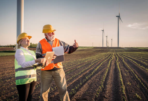 istock Windmill engineers inspection and progress check wind turbine 1317906594
