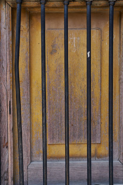istock Old wooden texture of windows and doors weathered by time with cracks and rusty nails 1317909744