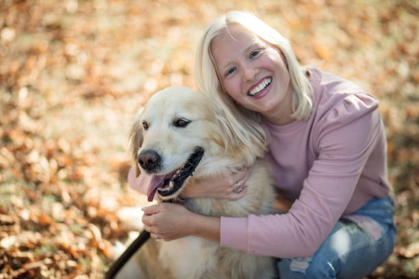 istock Woman playing in park with her dog. 1317910004