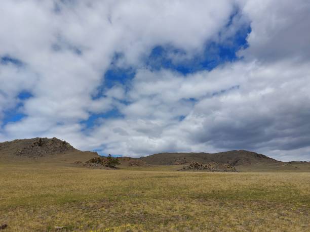 istock Rocky mountain view under Blue Sky with fluffy clouds 1317911172