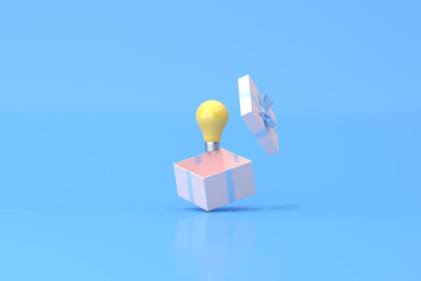 istock 3D rendering of yellow light bulb in open gift box on blue background, Minimal scene, Valentine. 1317912488