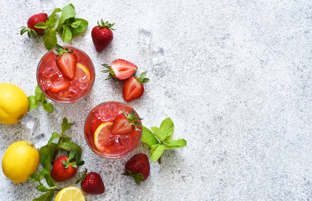 istock Strawberry lemonade with ice and mint, top view. Cold drink with strawberries. 1317914974
