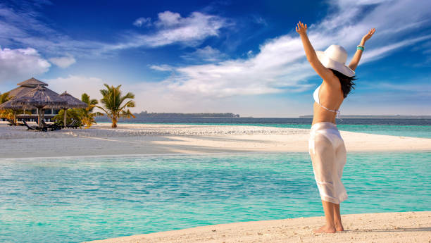 istock woman enjoying tropical vacation 1317916185