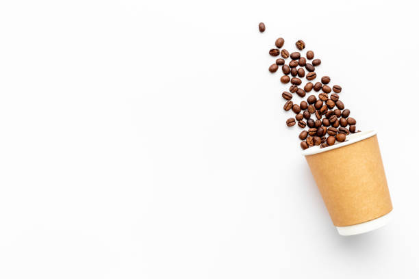 istock Paper cup with coffee beans. Coffee concept 1317916354