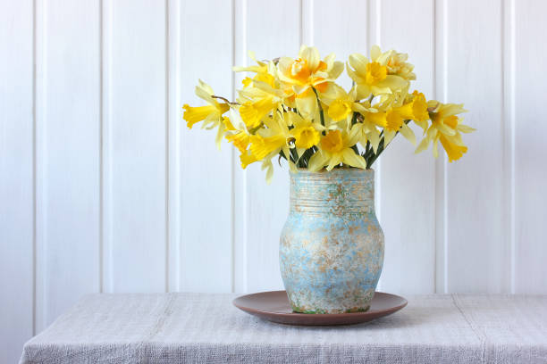 istock bouquet of yellow daffodils in a jug. 1317919940