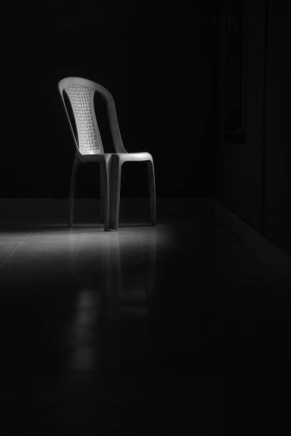 Two black chairs isolated on gray background in the studio with copy space. Job interview room.