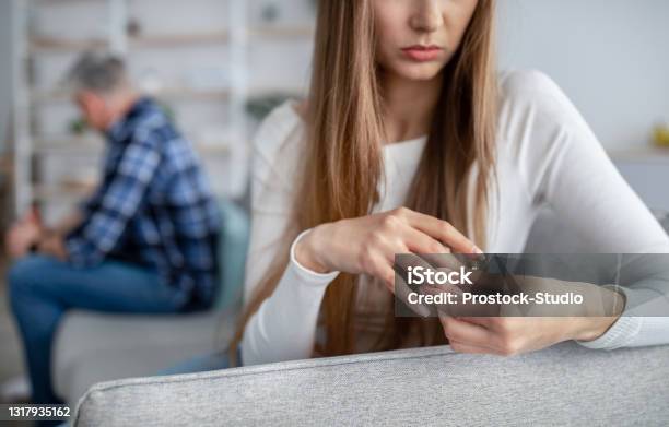 Cropped View Of Middleaged Woman Taking Off Wedding Ring Thinking About Breakup With Her Husband At Home Copy Space Stock Photo - Download Image Now