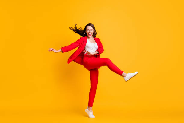 full length photo of pretty classy girl dance open mouth wear red suit jacket trousers sneakers eyewear isolated yellow color background - fato de senhora imagens e fotografias de stock