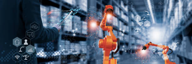 istock Industry engineer in factory,using smart tablet glass device,control automated robot arm machine learning operation,concept business and industry 4.0,Artificial intelligence or AI,with 5G network 1317940006