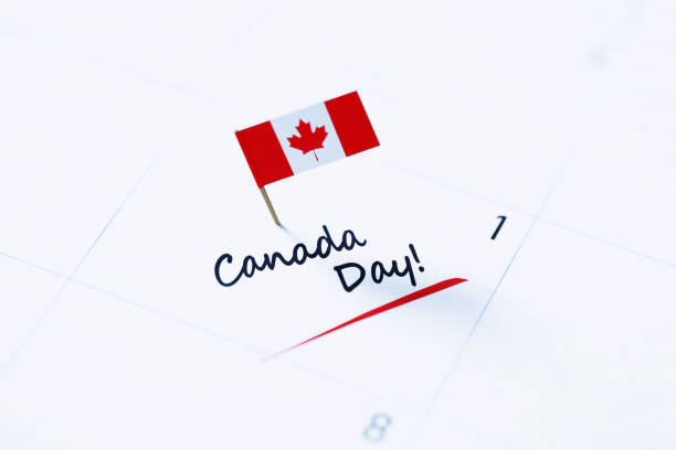 istock Canada Day Concept - Canada Day Note Pinned By Tiny Canadian Flag On A White Calendar 1317942255