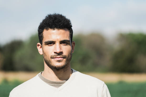 istock Close-up of a man looking at camera outside 1317943016