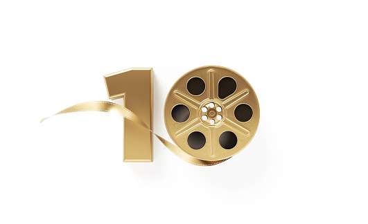 Gold colored film reel forming 10 on white background. Horizontal composition with copy space. Directly above. Top 10 films concept.