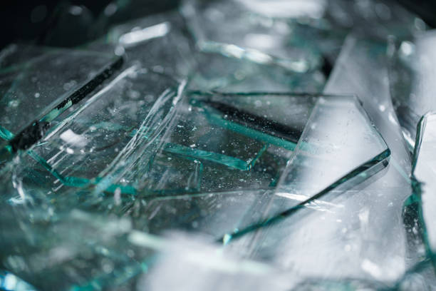Broken glass on floor background, top view, abstract