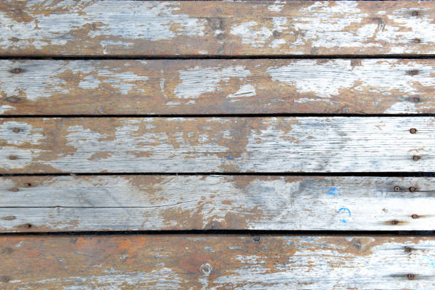 istock marine colored old shabby wooden background 1317943636