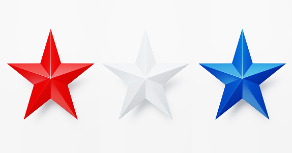 Blue red and white colored stars sitting on white background. Horizontal composition with clipping path and copy space. Directly above. Great use for independence Day and patriotism concepts.
