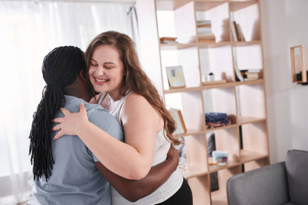 istock Couple in love embracing each other and laughing while dancing together 1317944736