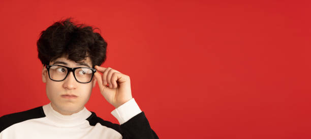istock Asian man's portrait isolated over red studio background with copyspace 1317946766