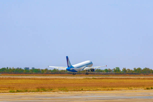 istock Passenger plane takes off from runway in airport 1317946850