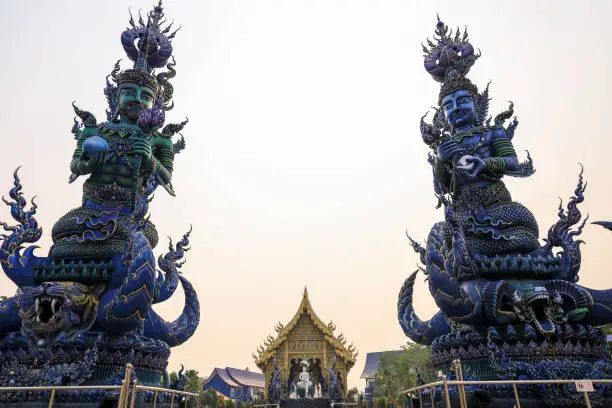 Photo of Double blue sculpture front of Wat Rong Sua Ten (Blue temple) in Chiang Rai, Thailand