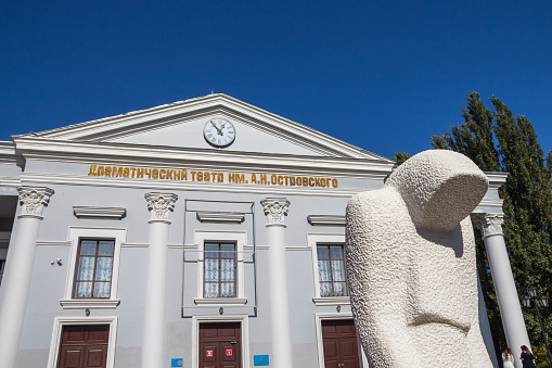 Drama Theater named after Ostrovsky in the city of Uralsk, White stone figures in front of the theater.