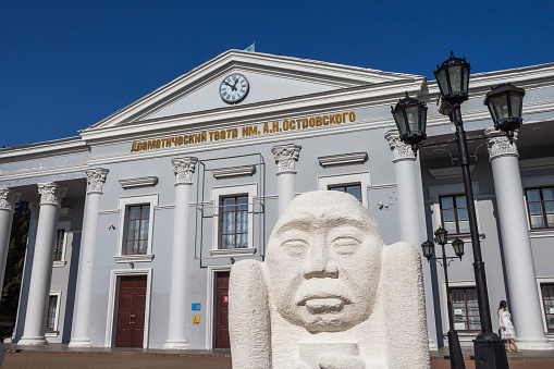 Drama Theater named after Ostrovsky in the city of Uralsk, White stone figures in front of the theater.