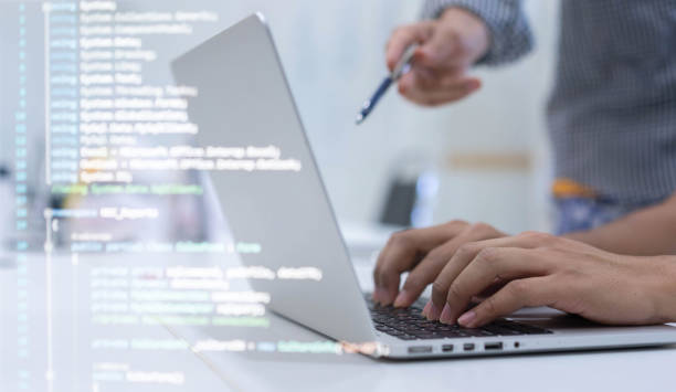 close up student programmer hand typing on keyboard on laptop to input code language into software for study bug and defect of system during suggest by specialist at office for educational technology concept cerrar la escritura manual del programador estudiantil en el teclado en el ordenador portátil para introducir el lenguaje de código en el software para el error de estudio y defecto del sistema durante la sugerencia de especialista en la oficina para el