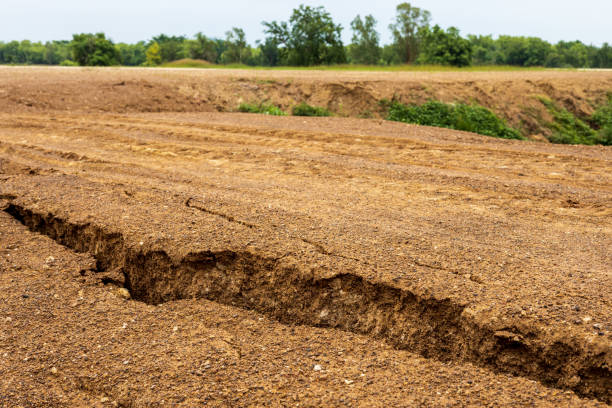 istock The mound of the dirt road has been eroded until it collapses. 1317949134