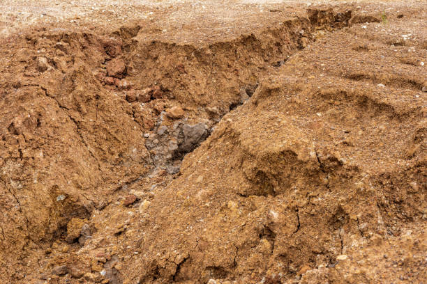 istock The mound of the dirt road has been eroded until it collapses. 1317949201