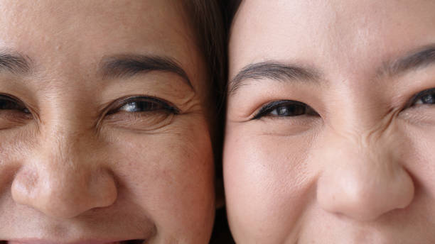 portrait close up attractive beautiful two asian people half face cheek smile to camera authentic real family mum and adult kid in woman power, diverse people, genes genetics ginger skincare concept. - wrinkles eyes imagens e fotografias de stock