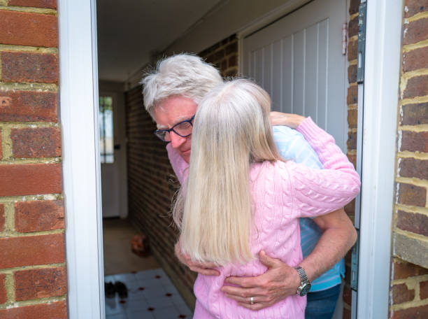 istock Seniors hugging again for the first time 1317949511