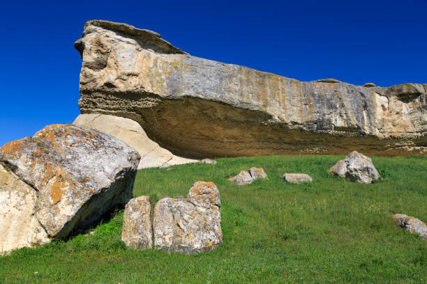 istock A smooth, huge rock, from the ledges of which a wide view opens. It is sand-colored, with almost no sharp corners. 1317950055