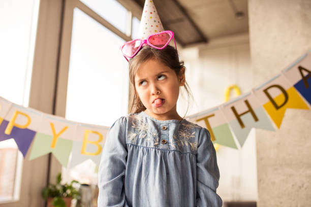 istock Girl making a face while showing her emotions during the celebrating her birthday 1317950176