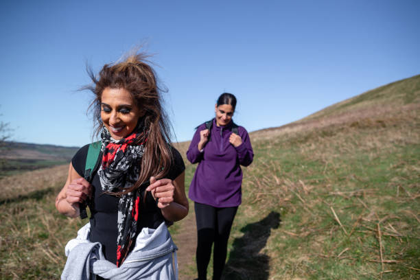 istock Two Friends Hiking In The Hills 1317950445