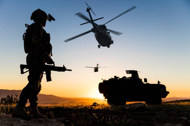 military operation at sunrise - tropa imagens e fotografias de stock