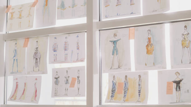 istock Fashion projects hanging on a window. Designer's studio 1317952896